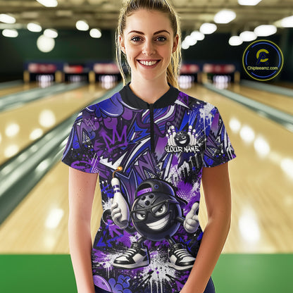 Woman wearing a purple and black bowling shirt with a bowling alley in the background