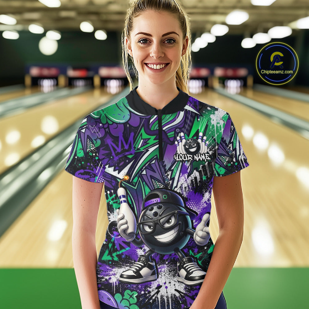 Person wearing a colorful bowling shirt with a graphic design in a bowling alley.