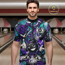Load image into Gallery viewer, Man wearing a colorful bowling shirt with a cartoon character in a bowling alley.