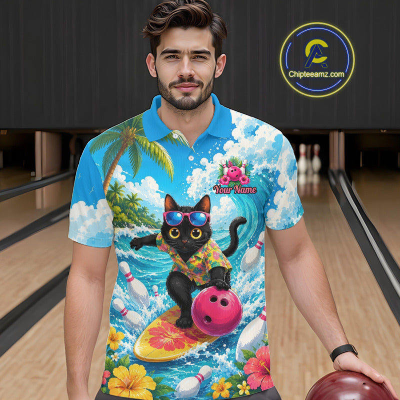 A man wearing a vibrant, custom-printed short-sleeve polo shirt in a bowling alley. The shirt features a colorful graphic of a black cat surfing on a yellow surfboard with a pink bowling ball, set against a tropical beach wave background with palm trees and hibiscus flowers.