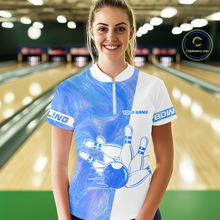Load image into Gallery viewer, Woman wearing a blue and white bowling jersey with a bowling alley in the background