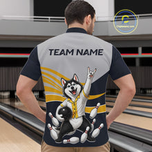 Load image into Gallery viewer, Person wearing a bowling-themed shirt with a dog graphic in a bowling alley.