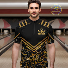 Load image into Gallery viewer, Male model wearing a custom black gold bowling quarter-zip shirt front view featuring a golden winged bowling ball emblem, geometric line pattern and premium black gold design at the bowling alley
