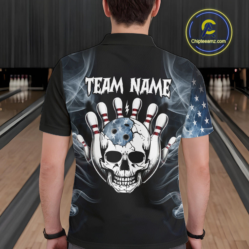 A man viewed from behind wearing a black short-sleeve polo shirt with a large back graphic featuring a skull over bowling pins, smoke effects, and the text 'TEAM NAME'. The right sleeve has a blue-and-white American flag print.