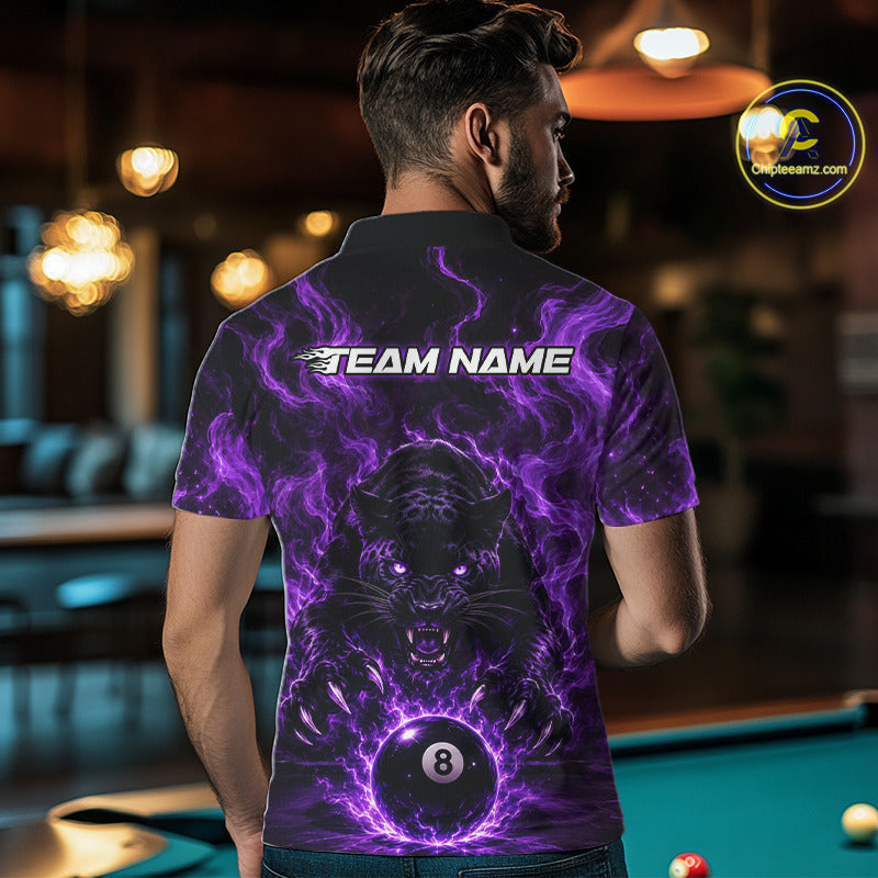 A man viewed from behind wearing a short-sleeve polo shirt with a purple and black graphic design featuring a panther and billiard balls, with 'TEAM NAME' printed across the upper back. The background is a blurred pool hall with a pool table visible.