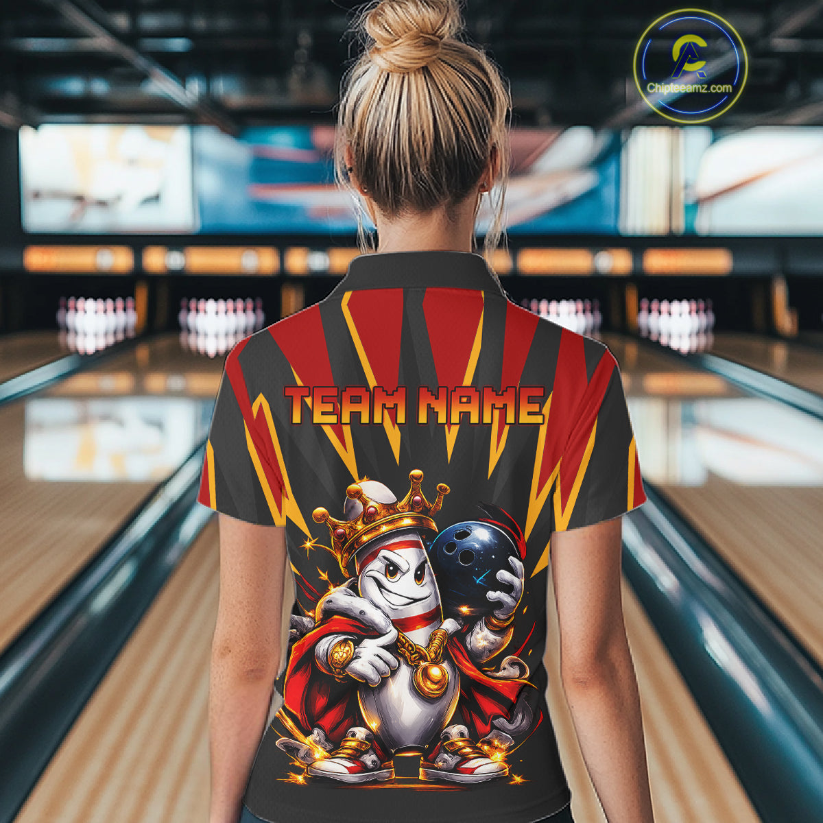 Person wearing a bowling-themed shirt with 'Team Name' text in a bowling alley.