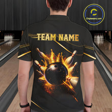 Load image into Gallery viewer, Man wearing custom black gold bowling polo shirt back view featuring a fiery bowling ball and flame burst effect, displaying Team Name, at the bowling alley