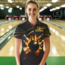 Load image into Gallery viewer, Woman wearing custom black gold bowling polo shirt front view featuring a fiery bowling ball and flame burst effect, displaying Your Name, at the bowling alley