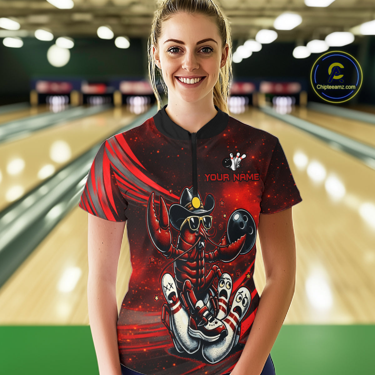 Person wearing a custom bowling shirt with a crawfish design in a bowling alley.
