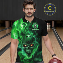 Load image into Gallery viewer, Man wearing a black bowling polo shirt featuring a flaming skull with glowing orange eyes, green smoke effects, and custom “YOUR NAME” text.