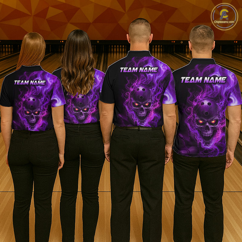 Four people wearing a black bowling polo shirt featuring a flaming skull with glowing orange eyes, purple smoke effects, and custom “TEAM NAME” text