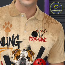 Load image into Gallery viewer, A close-up of a person wearing a beige short-sleeve polo shirt with bowling-themed graphics, including a bulldog illustration, bowling pins, a bowling ball, paint splatters, and the text 'YOUR NAME' and 'BOWLING'. A circular 'Chipeamz.