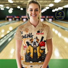 Load image into Gallery viewer, A woman standing in a bowling alley wearing a beige short-sleeve button-up shirt with a custom bulldog bowling graphic. The shirt features a bulldog in a yellow jacket holding a red bowling ball, with 'BOWLING' and 'YOUR NAME' text.