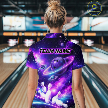 Woman wearing a purple bowling shirt with a galaxy design in a bowling alley.