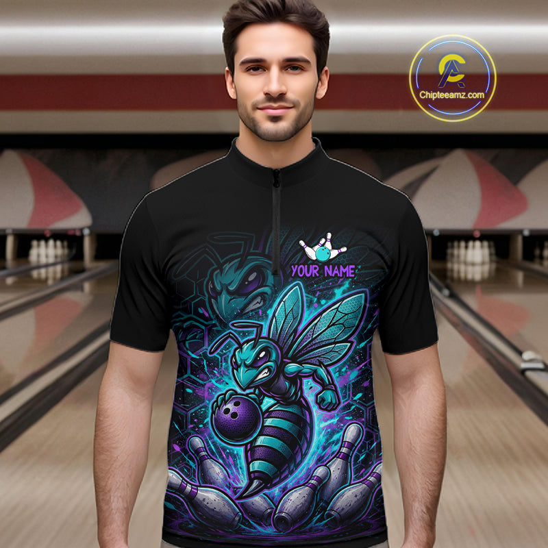 Man wearing a black bowling quarter zip with teal and purple bee graphics, custom team text, bowling pins, and a purple bowling ball.