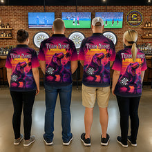 Load image into Gallery viewer, Four people wearing darts polo shirt featuring a dinosaur holding a dartboard with sunset and palm tree artwork on a colorful background.