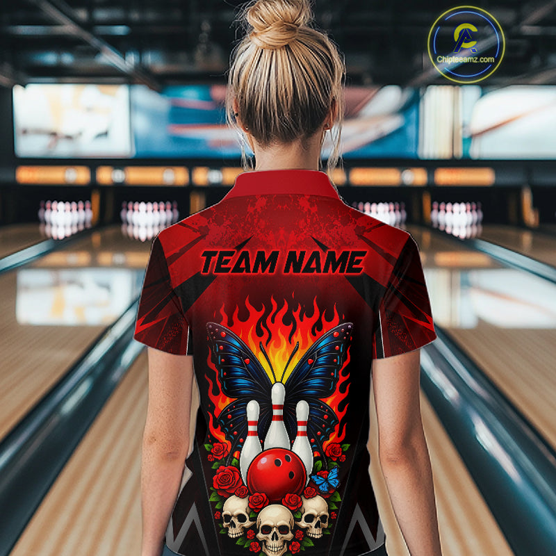 Woman wearing a red and black bowling quarter zip shirt featuring flaming bowling pins, a red bowling ball, a blue butterfly, roses, skulls, and custom team name text.