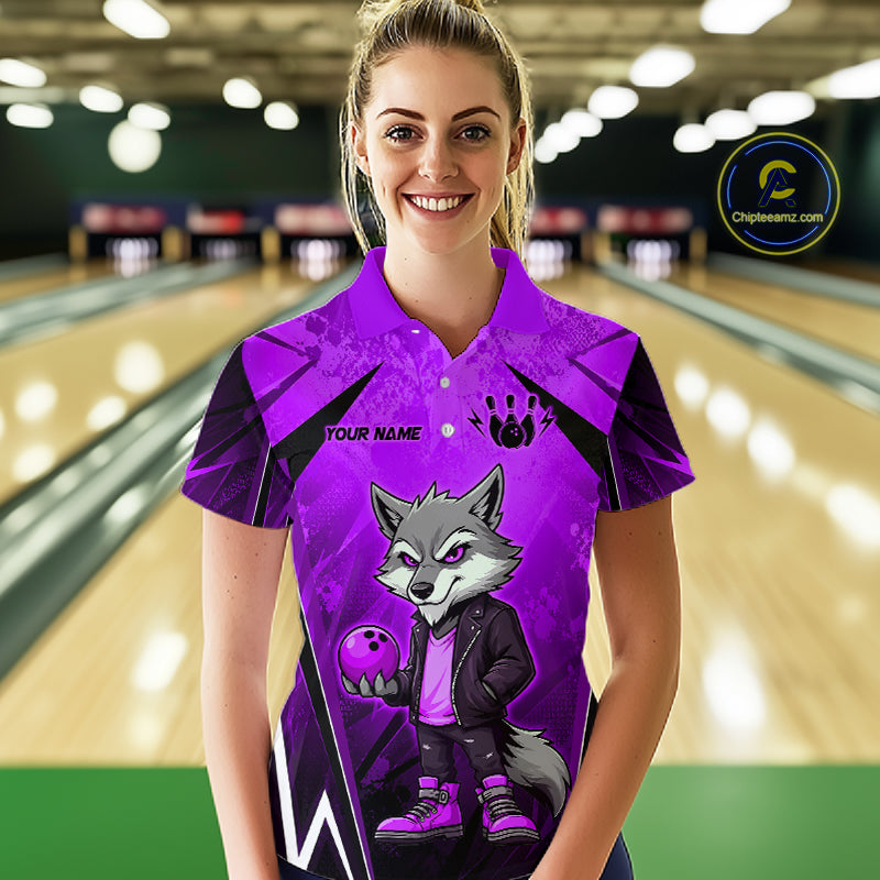 Woman wearing a purple and black bowling polo shirt featuring a gray wolf mascot holding a purple bowling ball, with custom player name text.