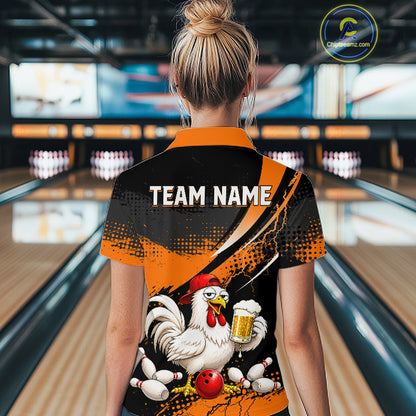 Woman wearing a orange and black bowling polo featuring a chicken holding a beer mug, red bowling ball, scattered pins, and custom team name text.