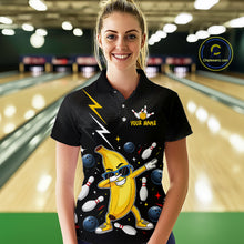 Load image into Gallery viewer, Person wearing a black bowling-themed shirt with a cartoon banana in a bowling alley.