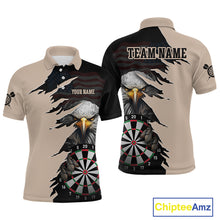 Load image into Gallery viewer, Front and back views of a beige and black darts polo featuring a bald eagle, torn-flag graphics, dartboard designs, and custom team text.