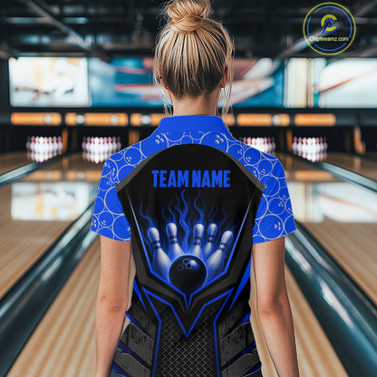 Person wearing a blue and black bowling shirt with 'TEAM NAME' text in a bowling alley.
