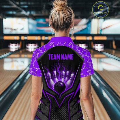 Person wearing a blue and black bowling shirt with 'TEAM NAME' text in a bowling alley.