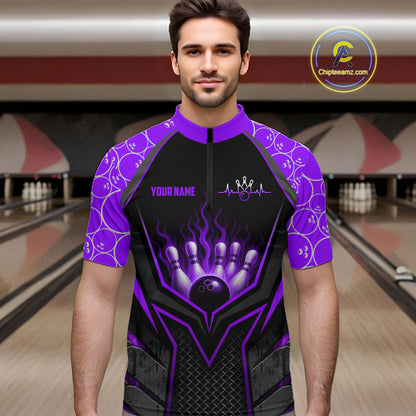Man wearing a black and purple bowling shirt with a design on a bowling alley background