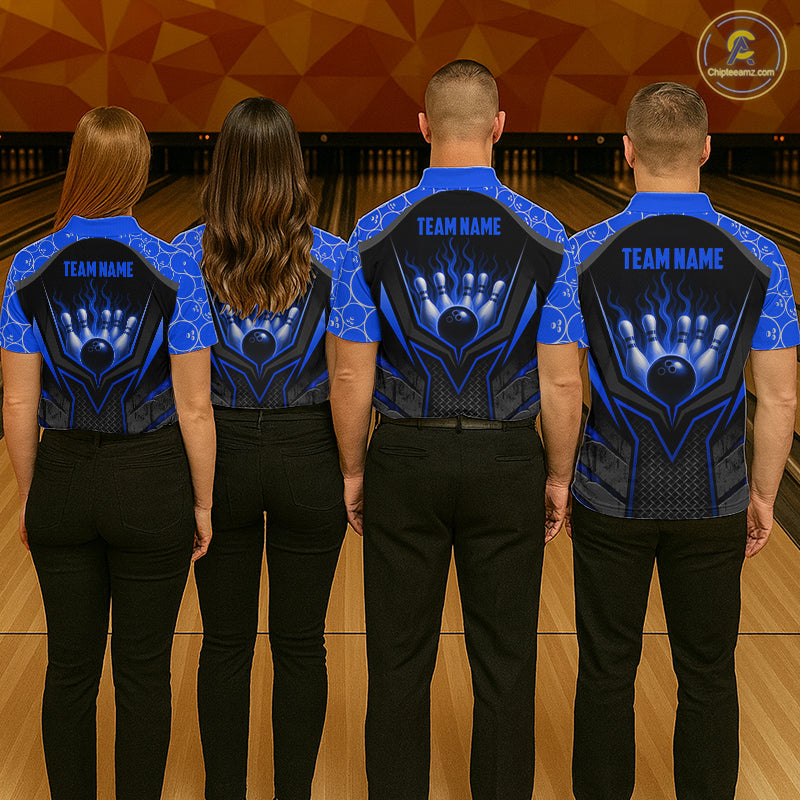 Four people wearing matching blue and black bowling shirts with 'TEAM NAME' on a bowling alley.