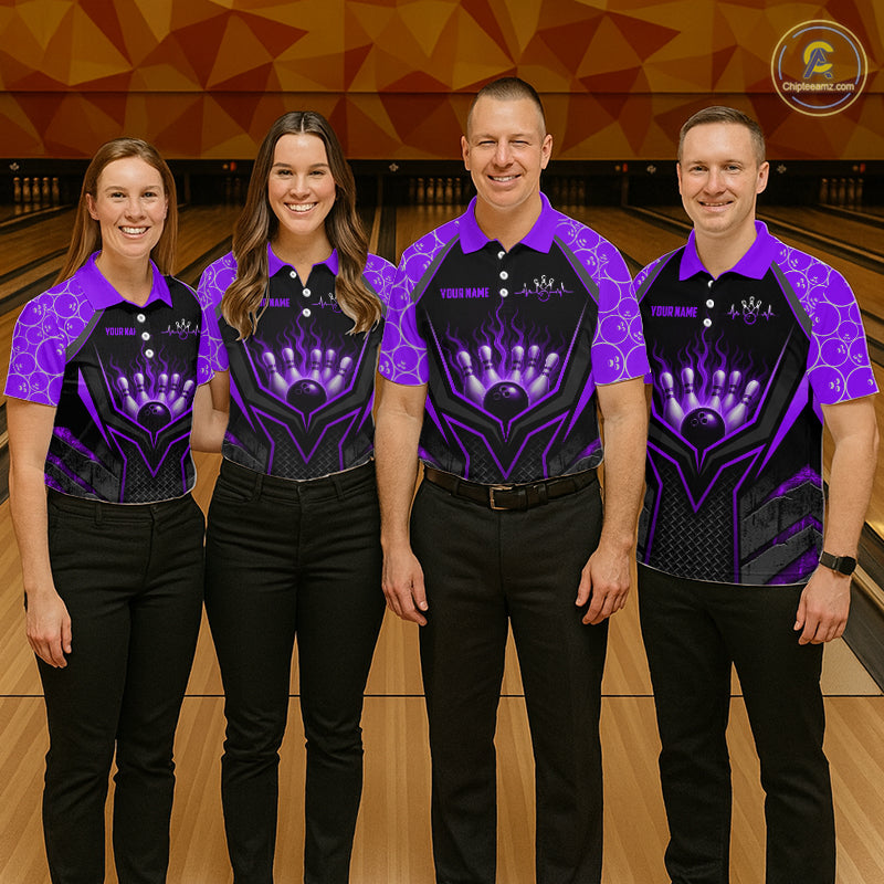 Four people wearing matching purple and black bowling shirts on a bowling alley.
