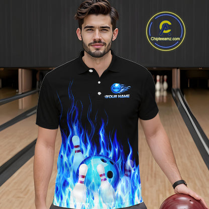 Man wearing a black polo shirt with a blue and white design of a bowling ball and pins, standing in a bowling alley.