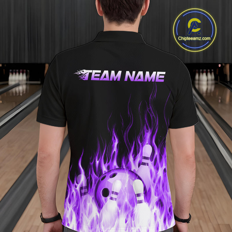 Person wearing a black bowling shirt with purple flames and a bowling ball design in a bowling alley.
