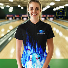 Load image into Gallery viewer, Person wearing a black bowling shirt with blue flame design and logo in a bowling alley.