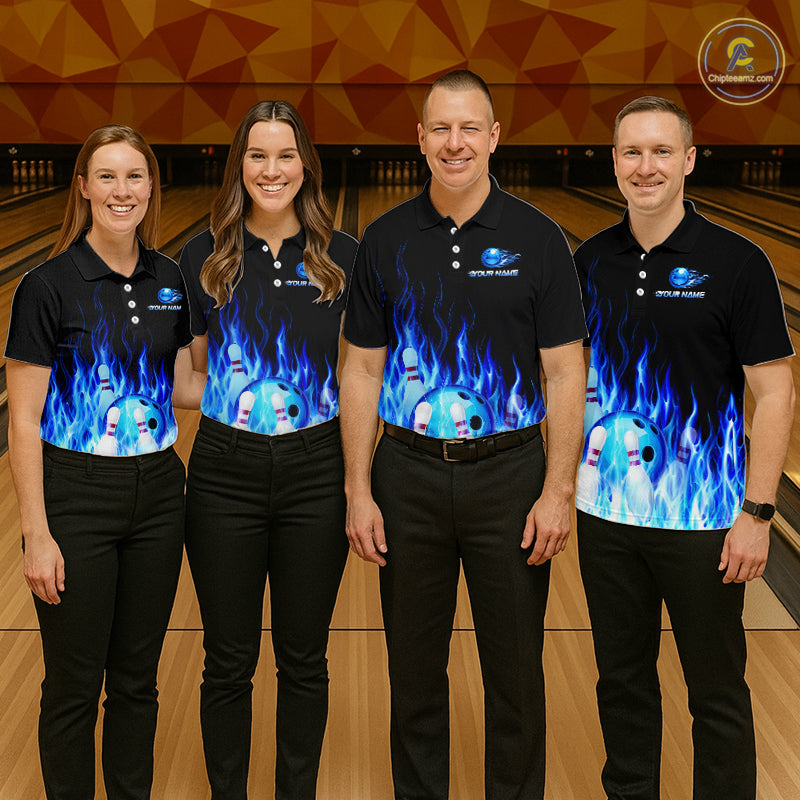 Four people wearing matching bowling shirts with a flame design on a bowling alley.