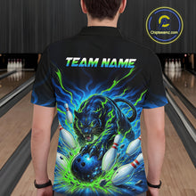 Load image into Gallery viewer, Person wearing a black bowling shirt with a colorful tiger design and 'TEAM NAME' text in a bowling alley.