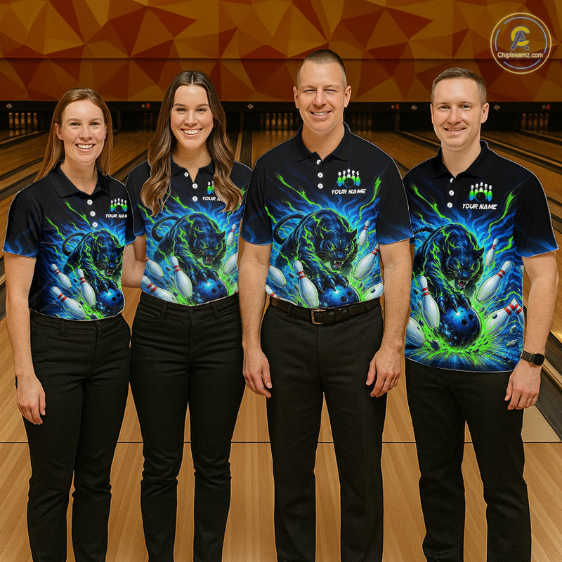 Four people wearing matching bowling shirts with a colorful design on a bowling alley.