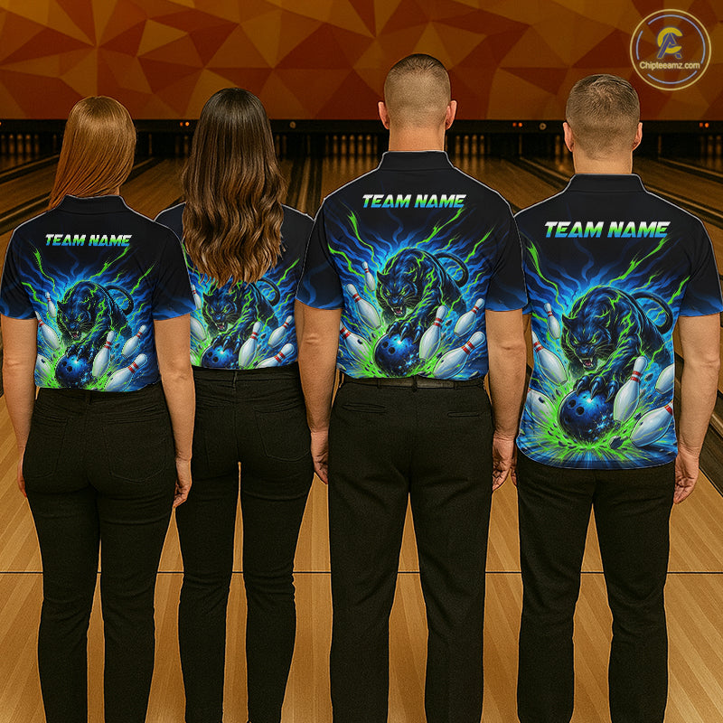 Four people wearing matching bowling team shirts with a design of a tiger and bowling pins on a bowling alley.