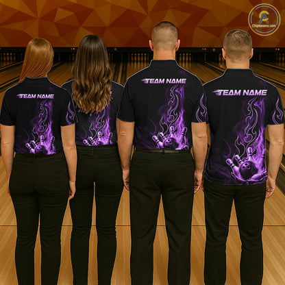 Four people standing in a bowling alley, viewed from behind, wearing matching black short-sleeve shirts with purple flame graphics and white 'TEAM NAME' text on the back.