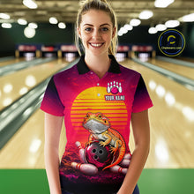 Load image into Gallery viewer, Women’s retro sunset bearded dragon bowling polo shirt, front view on female model in bowling lane 
