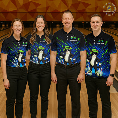 Four people standing together in a bowling alley wearing matching black short-sleeve bowling shirts with a blue and yellow lightning design and a cartoon cat wearing a bowler hat. The shirts also have placeholder text and a circular logo in the top right corner.