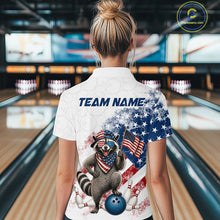 Load image into Gallery viewer, Women’s us flag raccoon bowling polo shirt, back view on female model in bowling lane 