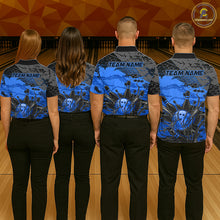 Load image into Gallery viewer, Four people wearing matching blue and black shirts with a design on a bowling alley background