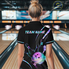 Load image into Gallery viewer, Person wearing a black bowling shirt with colorful designs and 'TEAM NAME' text in a bowling alley.