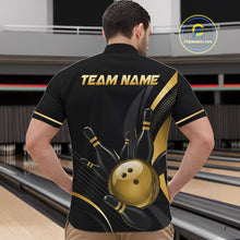 Load image into Gallery viewer, Person wearing a black bowling shirt with gold graphics and 'TEAM NAME' text at a bowling alley.