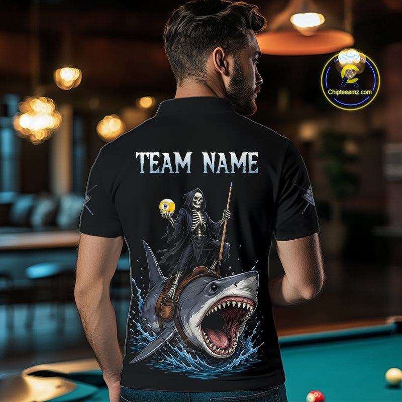 Man wearing a black t-shirt with a graphic design of a skeleton on a shark, with 'TEAM NAME' text, in an indoor setting.