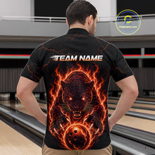 Load image into Gallery viewer, Person wearing a black t-shirt with a fiery panther design and 'TEAM NAME' text on the back, standing in a bowling alley.