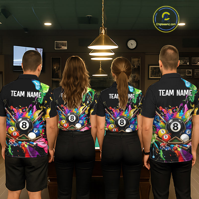 Four people wearing matching colorful sports jerseys with pool ball designs in a bar setting.