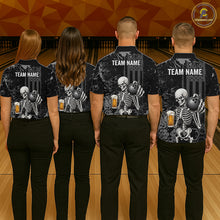 Load image into Gallery viewer, Four people standing with their backs to the camera in a bowling alley, wearing matching black short-sleeve shirts with a skeleton graphic holding bowling balls and beer glasses, plus white 'TEAM NAME' text on the back.