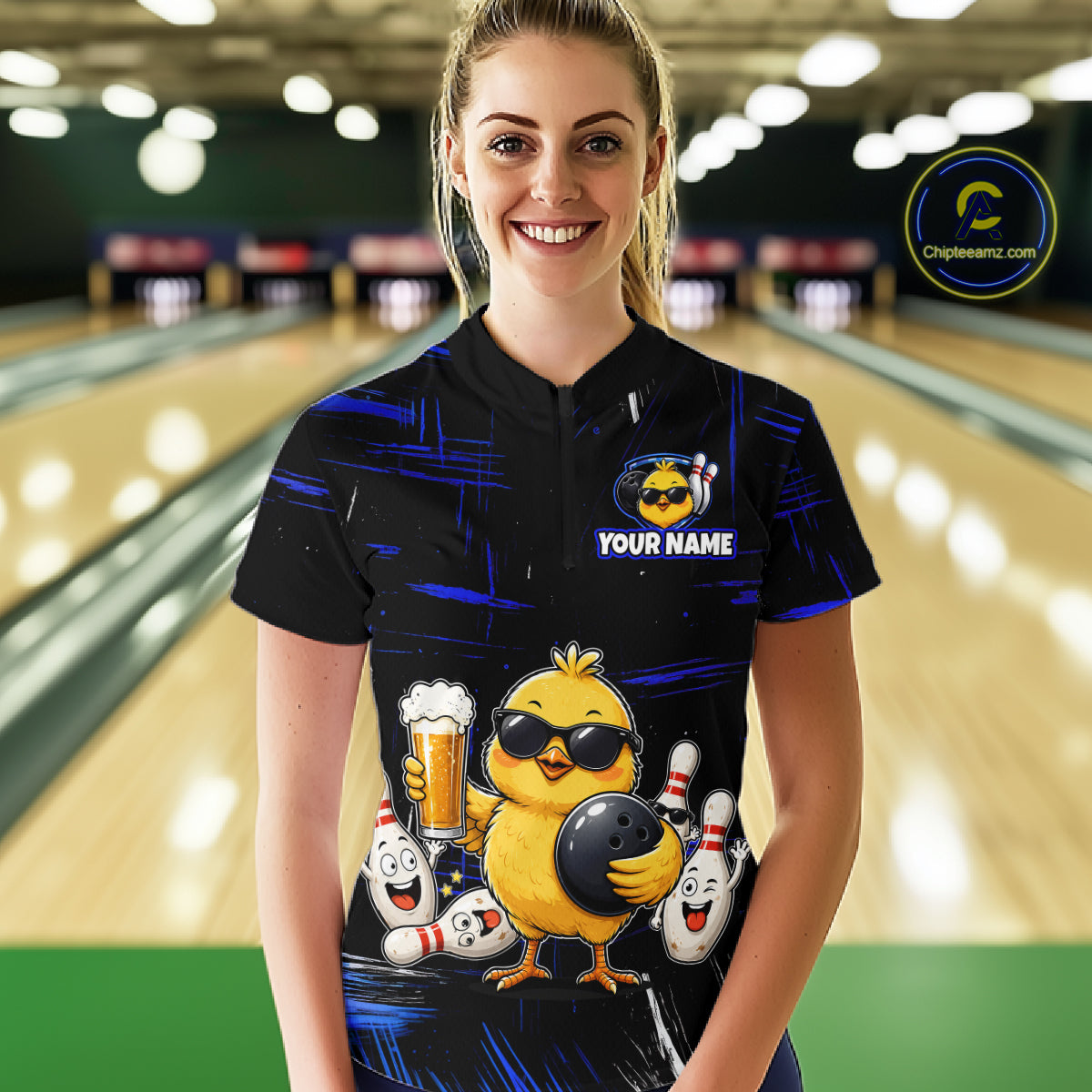 Women wearing bowling polo shirt featuring a chick holding a bowling ball surrounded by smiling pins and beer graphics on black yellow background