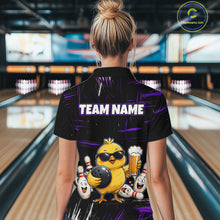 Load image into Gallery viewer, Women wearing bowling polo shirt featuring a chick holding a bowling ball surrounded by smiling pins and beer graphics on black yellow background.